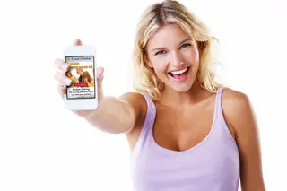 A pretty young woman showing you her smartphone with Chat2Date on the screen